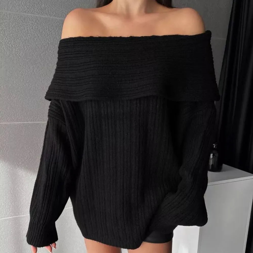 A woman's loose-fitting, long-sleeved pullover sweater in acrylic fibre, shown on a hanger.