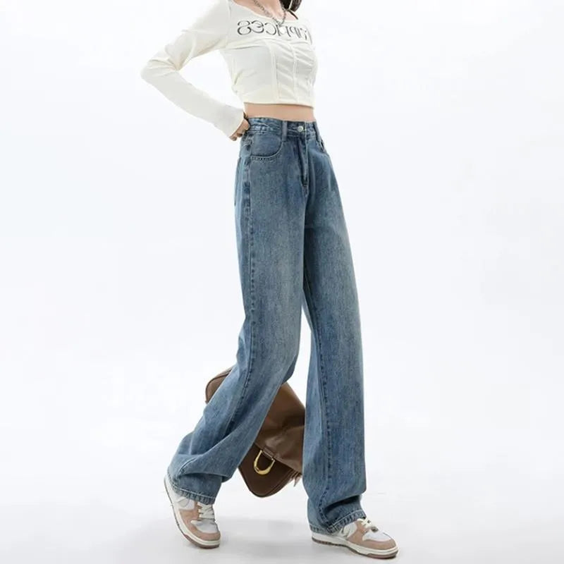 Retro blue high-waist wide leg jeans on a hanger showing straight leg trouser cut.