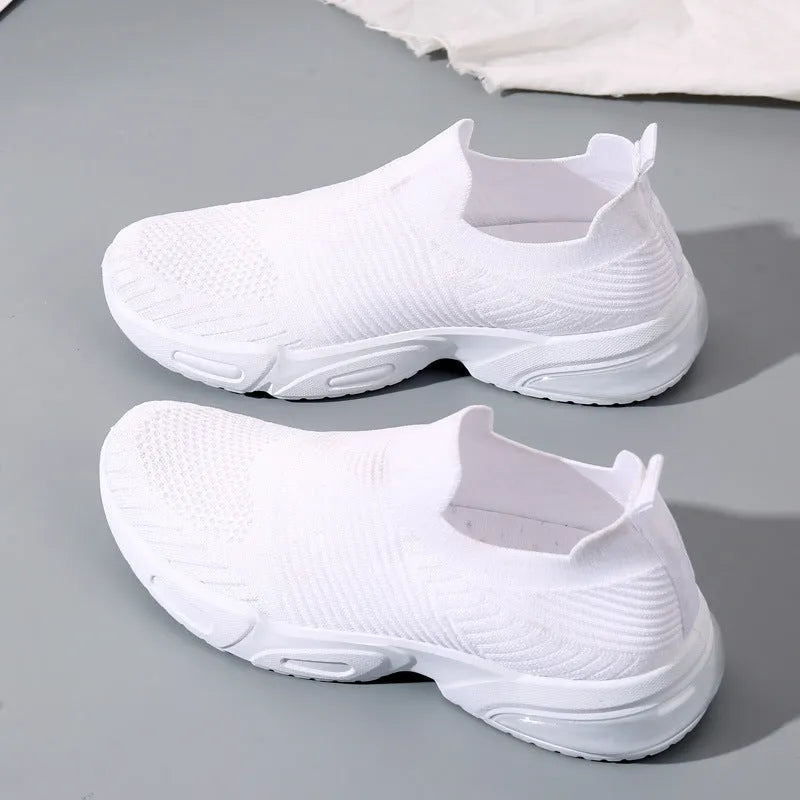 Breathable slip-on sock shoes in black, pink, khaki, and white colours with mesh lining and PVC sole.