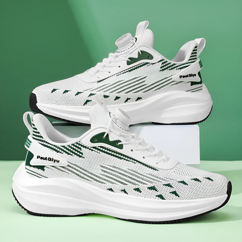Men's white and green casual running shoes with rotating buckle and Fly-knit mesh upper on a flat TPU sole.