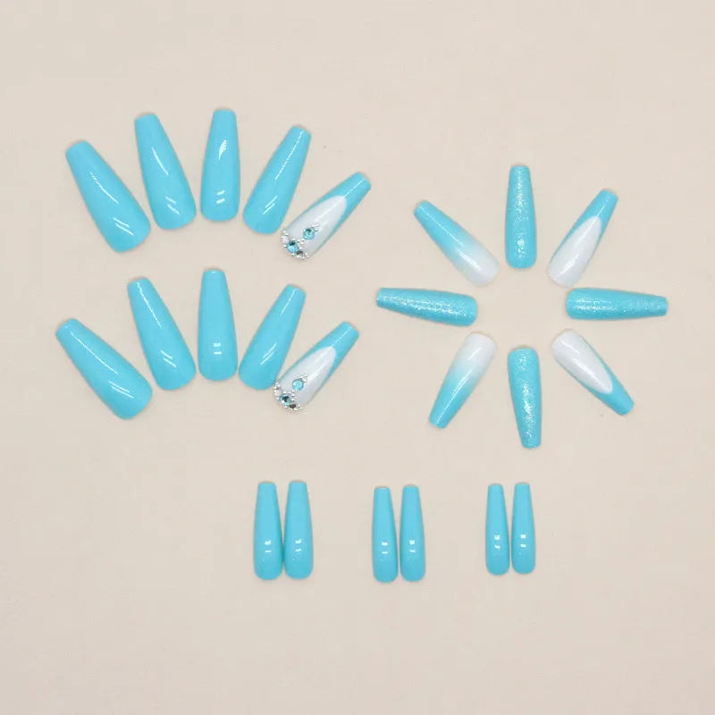 Long ballet-shaped false nail art patches in solid smart blue diamond colour with a tube of nail glue.