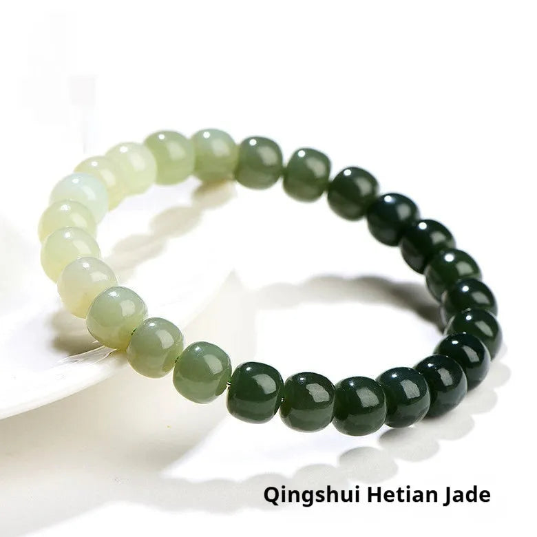 Natural clear water Hetian jade ball bracelet showing gradient jade beads in round or barrel shapes