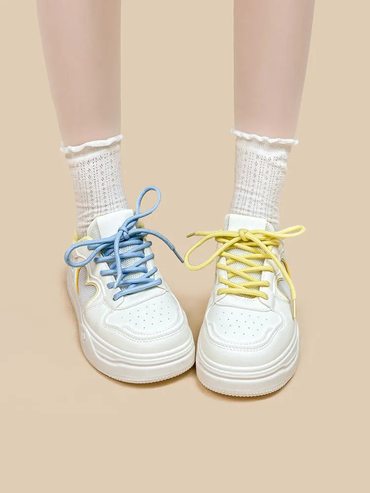 Meow Rabbit Sea Salt Cheese coloured sneakers with mesh cross straps and a thick rubber sole.