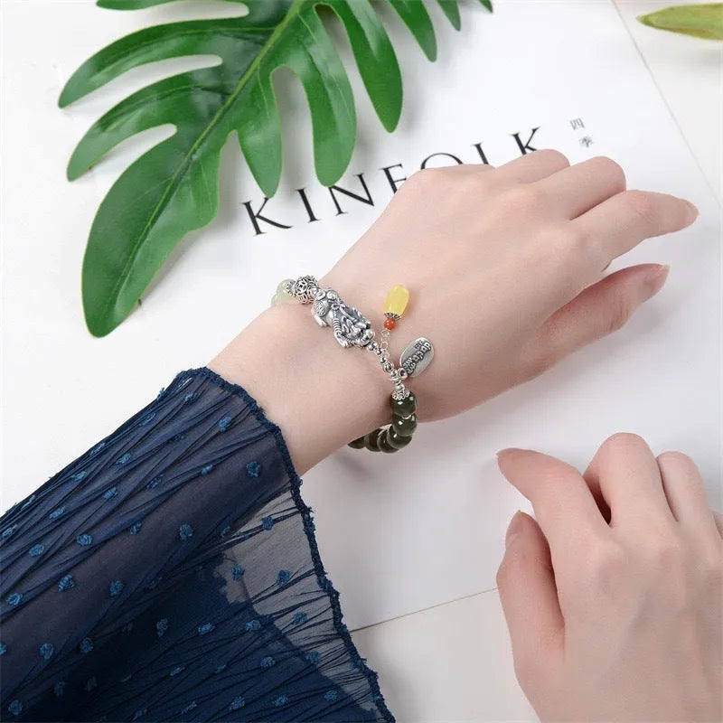 Retro women's bracelet with pure silver coin charm and natural Hetian jade bead