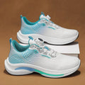 Men's low-top white and orange sneaker with a rotating buckle on a breathable mesh upper.