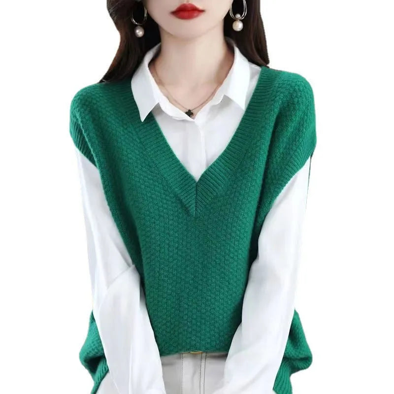 V-neck sleeveless knitted pullover vest with a raised 3D pattern in beige.