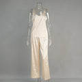 Polyester suspender trousers pyjama suit in navy blue with European American style top and matching trousers on model