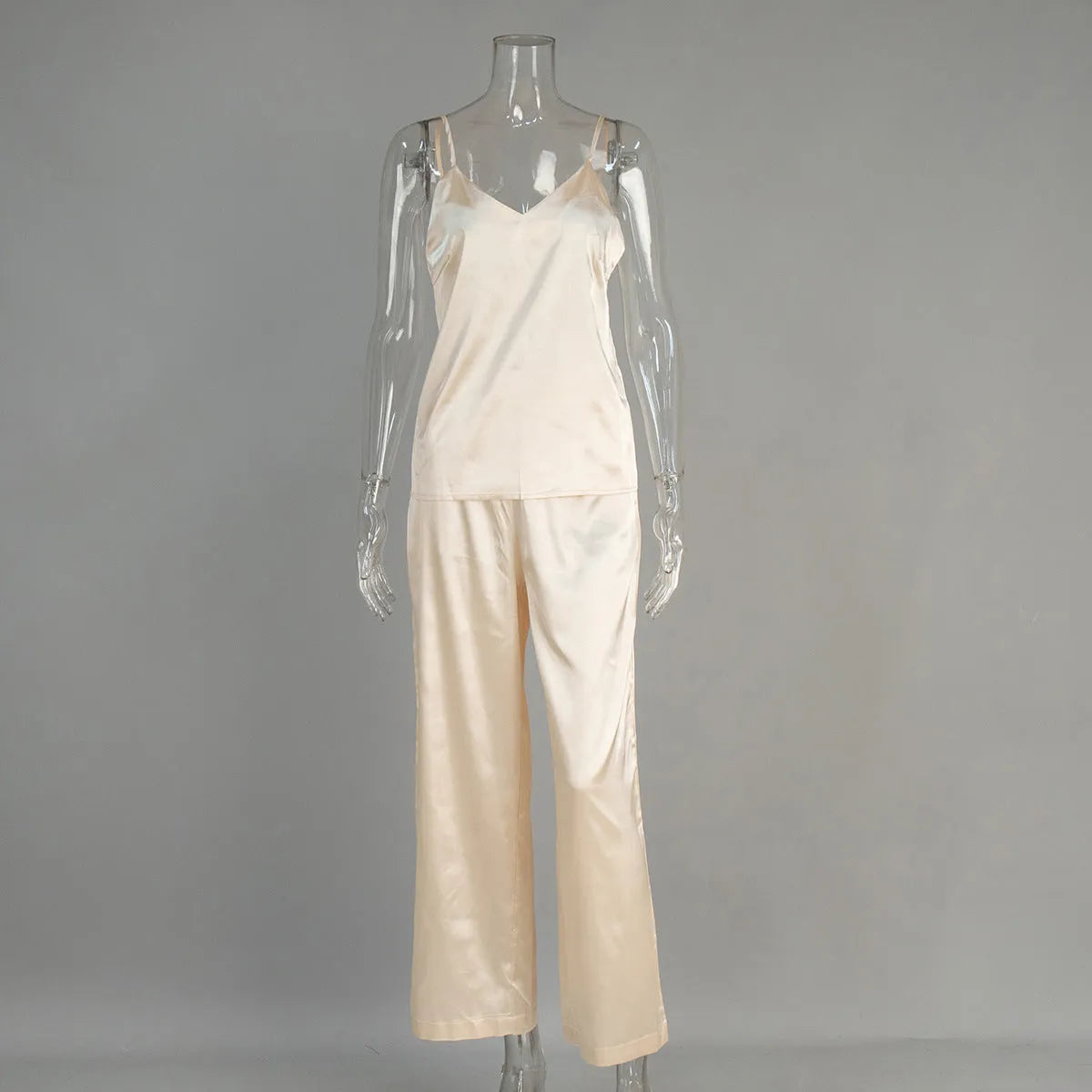 Polyester suspender trousers pyjama suit in navy blue with European American style top and matching trousers on model