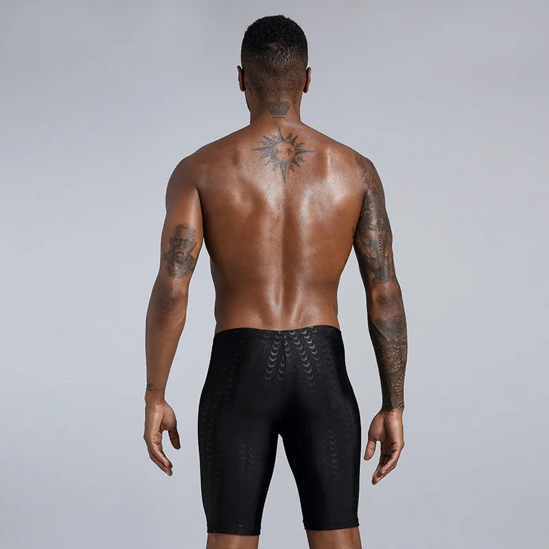 Men's solid colour waterproof polyester swimming trunks on a size chart showing XL, XXL, 3XL, 4XL.