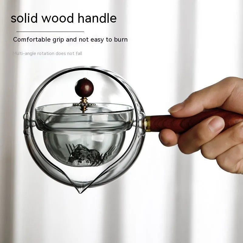 Semi-automatic rotary glass teapot with wooden handle and infuser, in grey and transparent colour options.