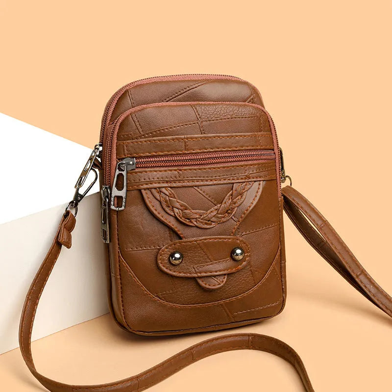 Soft brown PU leather square vertical mobile phone bag with woven detailing and rivets.