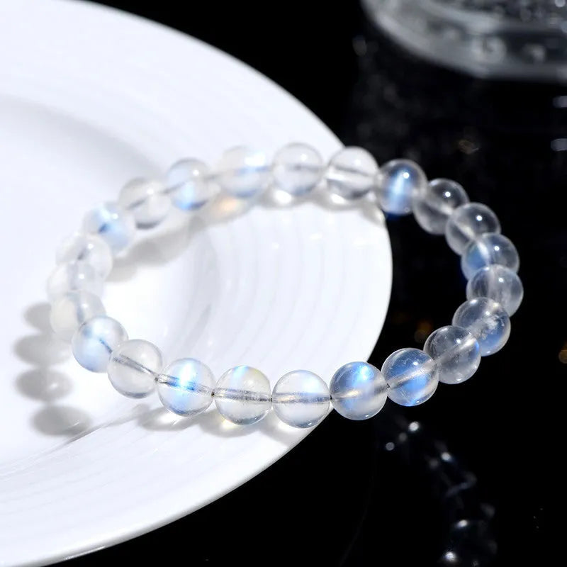 Natural cream body blue moonlight crystal bracelet with grinding finished beads on wrist