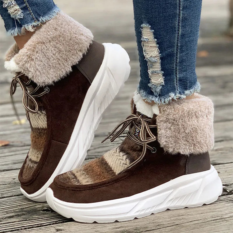 Women's beige lace-up snow boots with suede upper, thick rubber sole, and fuzzy lining.