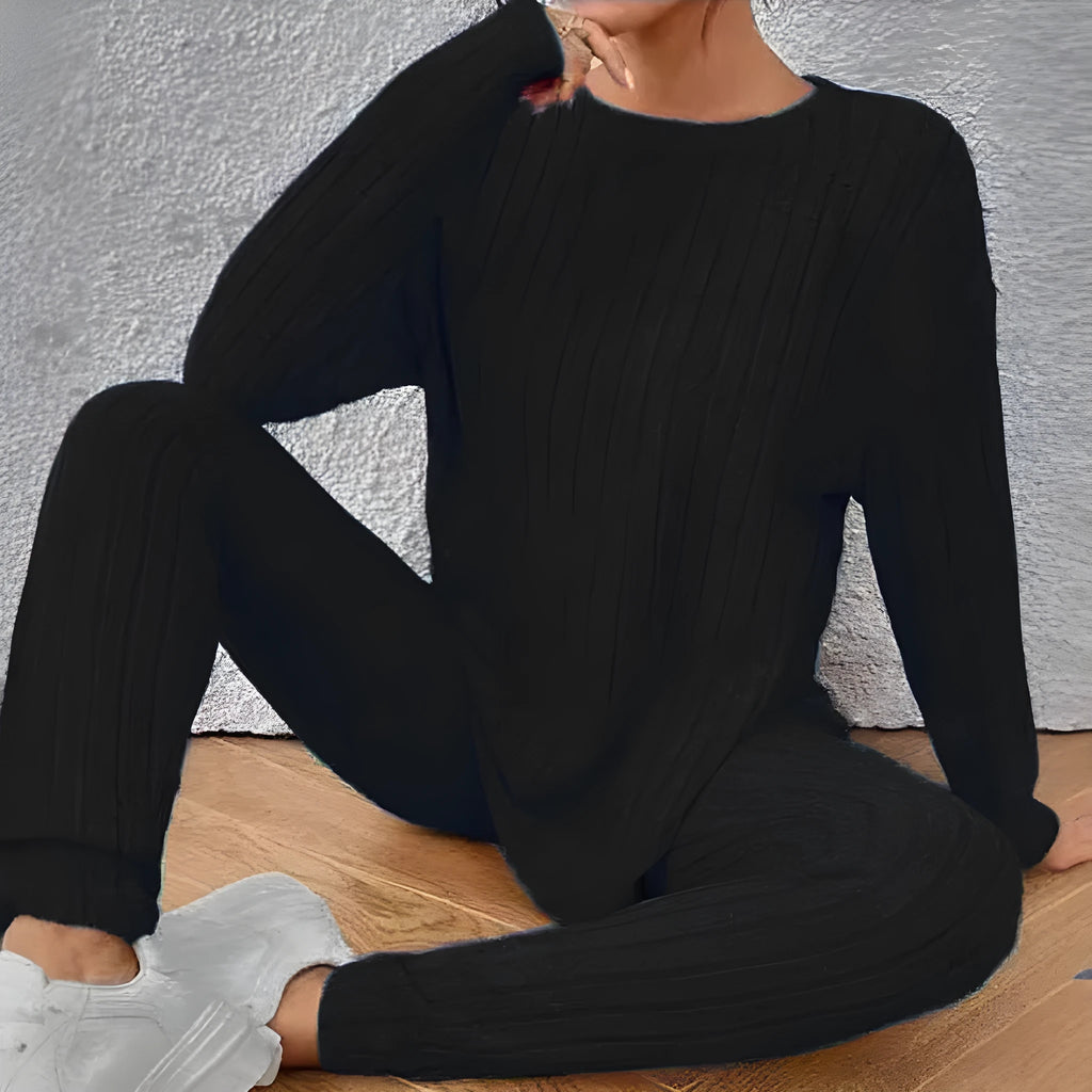 Sunken stripe black polyester two-piece homewear set showing trousers and top on Asian size mannequin