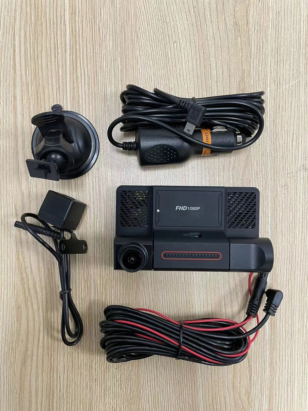 Black three-lens dashcam with 4-inch touch screen for front and rear vehicle recording