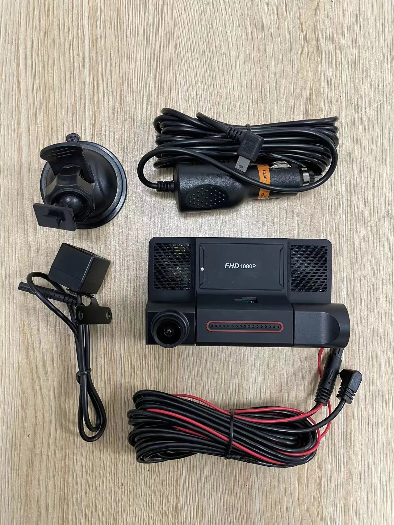 Black three-lens dashcam with 4-inch touch screen for front and rear vehicle recording