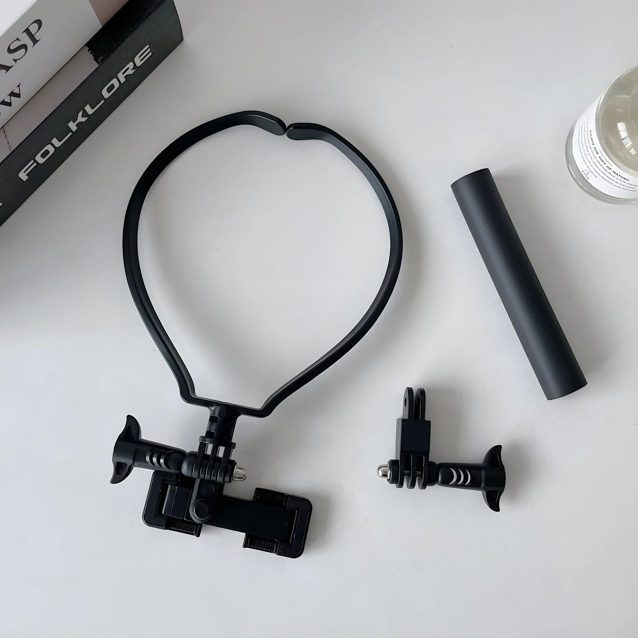 Universal plastic cell phone neck hanging bracket in black with horizontal and vertical clip, extension, and anti-slip cushion