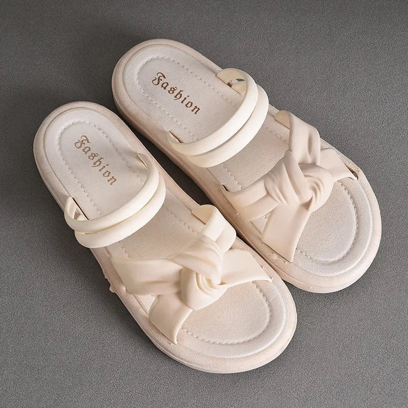 Women's black outdoor sandals with thick soft back and flower detailing on PVC upper