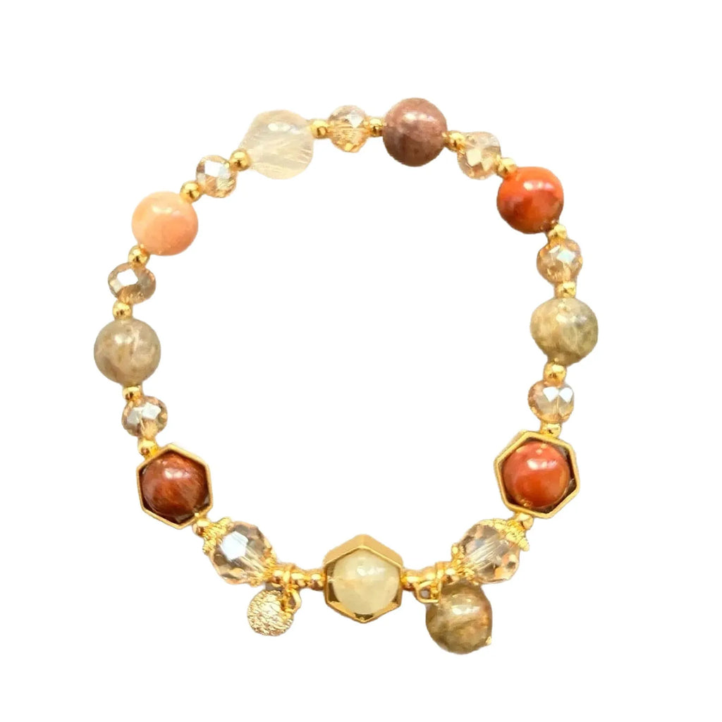 Gold crystal bracelet with 8mm beads showing hand-woven construction and traditional auspicious symbols