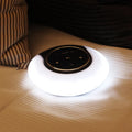 Blue and white Bluetooth speaker desk lamp with touch controls and foldable arms on wooden desk