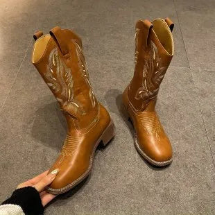 Brown women's mid-calf embroidered Martin boots with a leather lining and a low square heel.