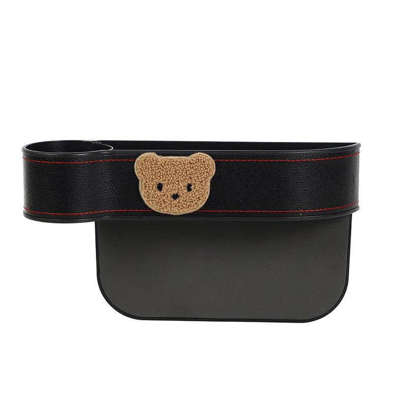 Car seat gap storage box with cartoon bear design in synthetic leather for vehicle organisation