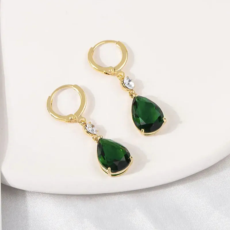 A pair of green geometric teardrop-shaped dangle earrings made from alloy.