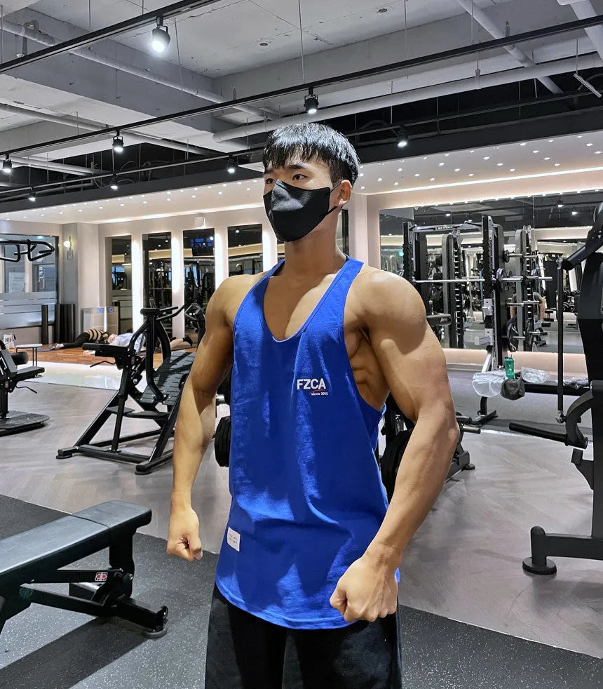 Men's cotton fitness vest for summer running and training in white, red, black, blue, or light green.