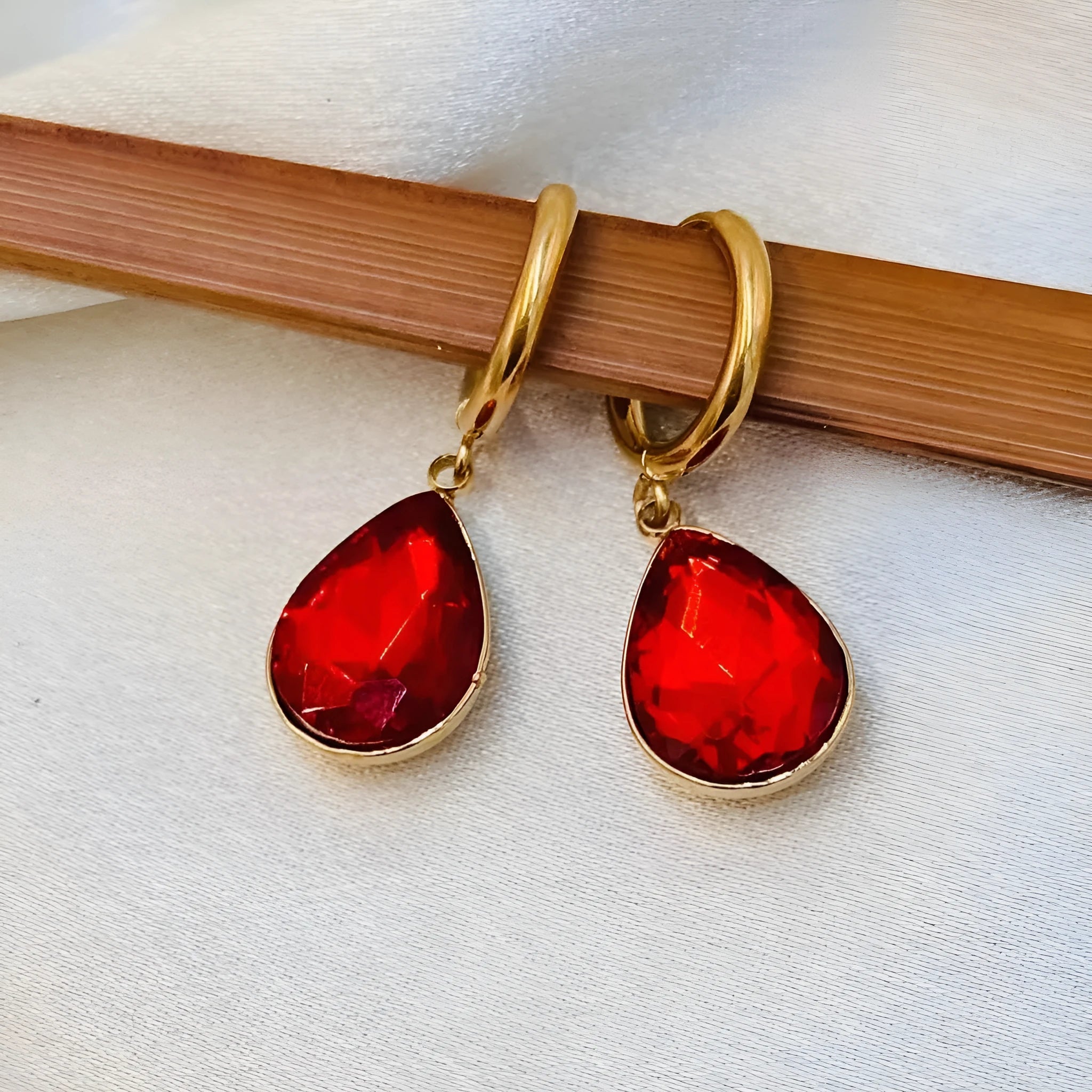 Geometric carved earrings with glass water drops and Saturn design in mixed materials