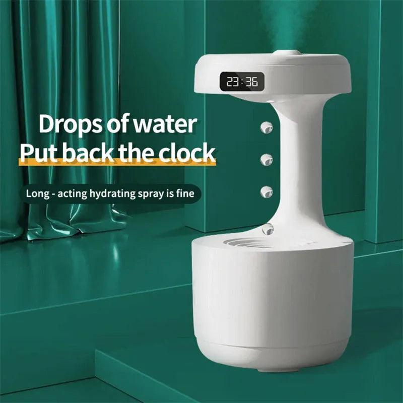 Bedroom anti-gravity humidifier with clock and backflow aroma diffuser in white plastic on desk with LED display