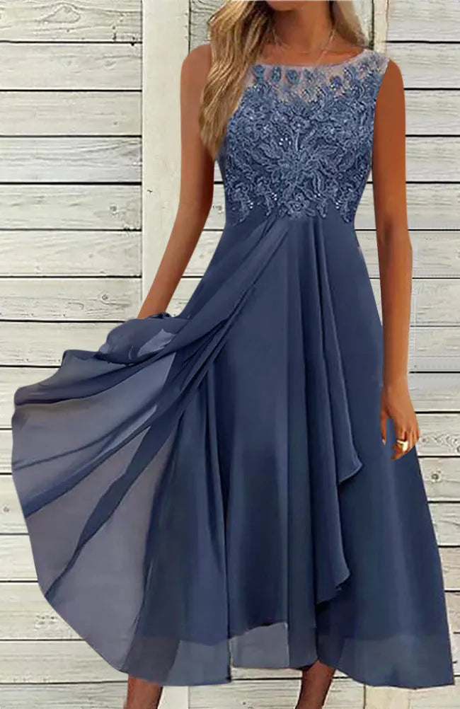 Women's sleeveless green chiffon dress with lace embroidery and a mid-length flowy skirt.