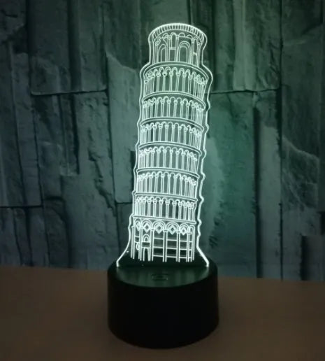 3D acrylic Leaning Tower of Pisa night light glowing in blue on a black base with remote control.