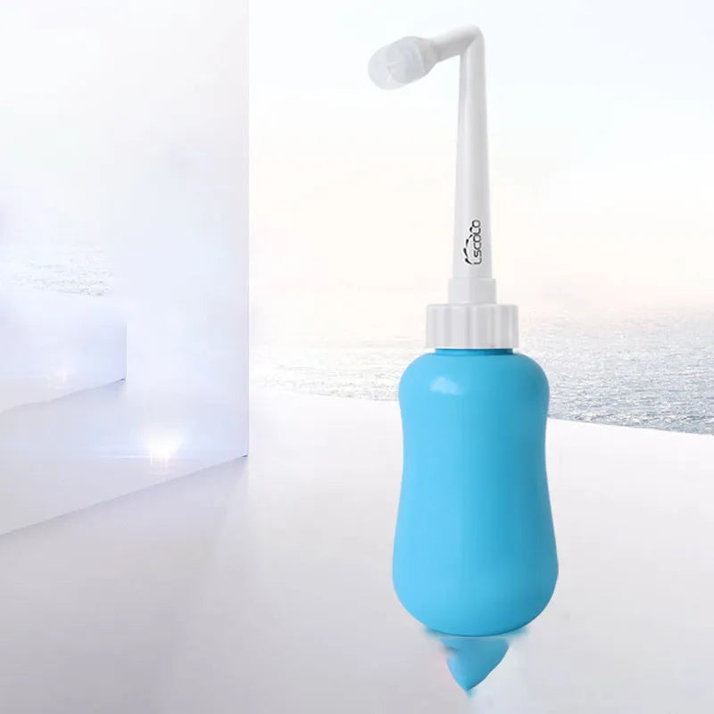 Portable female washer irrigator in blue 450ml with telescopic elbow nozzle on white background
