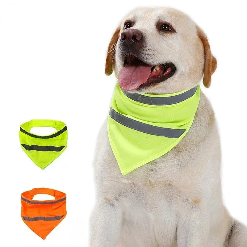 Yellow and orange reflective dog bandana with adhesive strap, shown on a dog's neck.