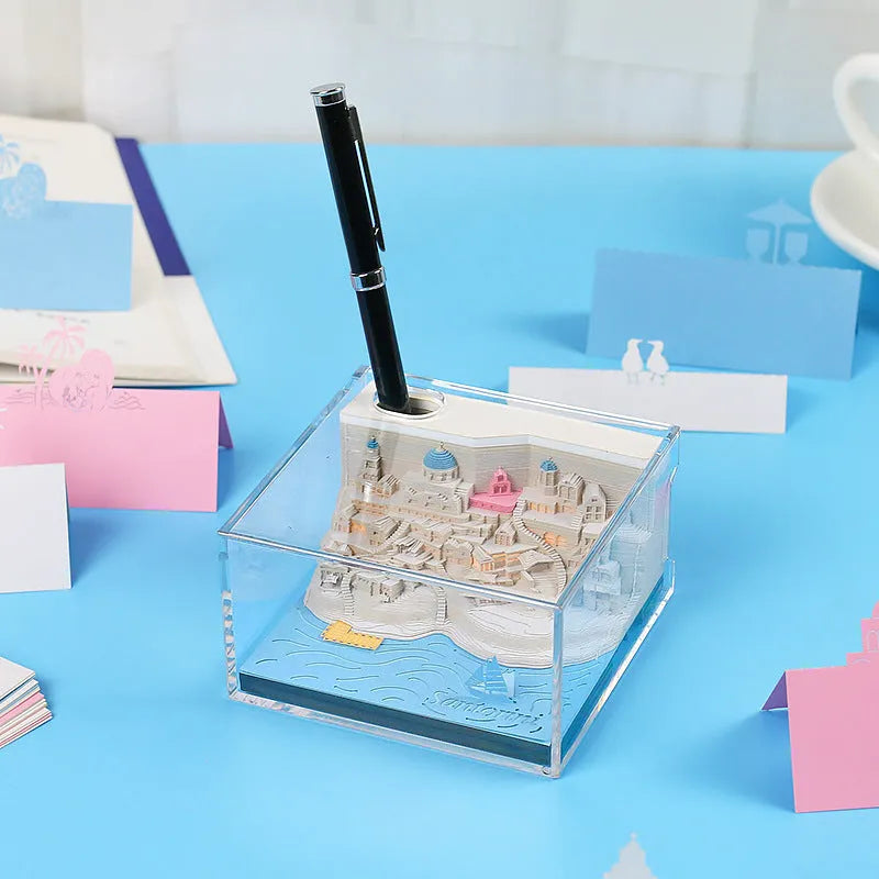 Illuminated 3D paper carving model of Santorini beach with integrated notepad