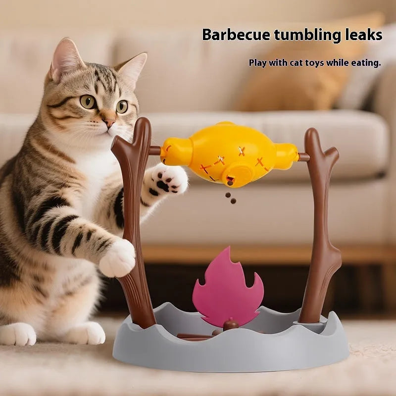 Barbecue style tumbling cat feeder toy for interactive food puzzle play.