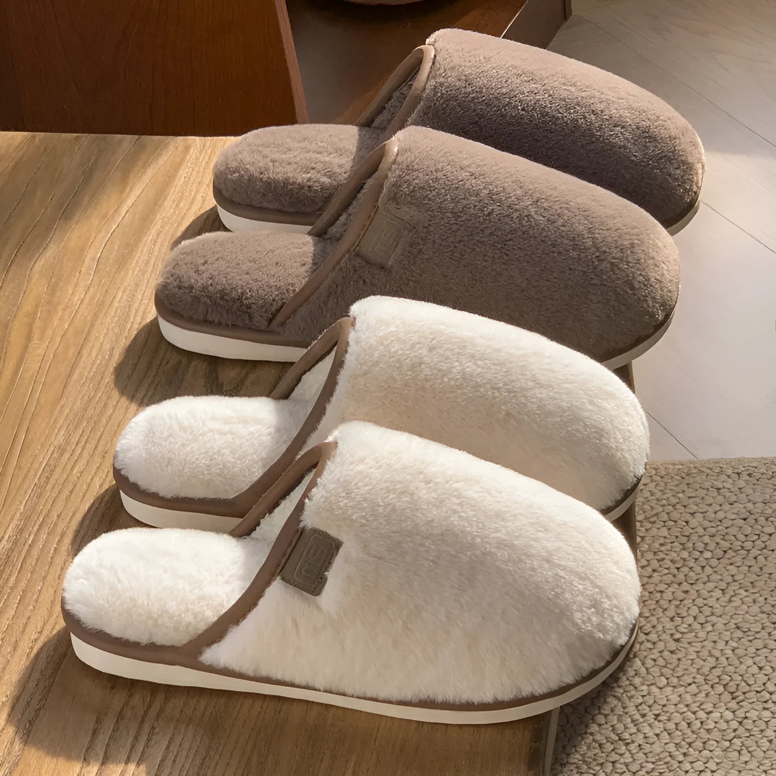 Pair of solid-colour plush winter slippers with a PVC upper and non-slip sole.