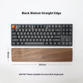 Black walnut wooden keyboard palm rest with wrist strap, 440mm long, on a desk