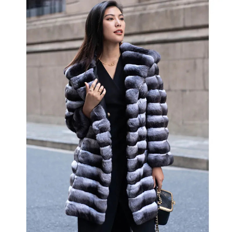 Women's zebra stripe pattern artificial mink faux fur mid-length coat on a hanger.