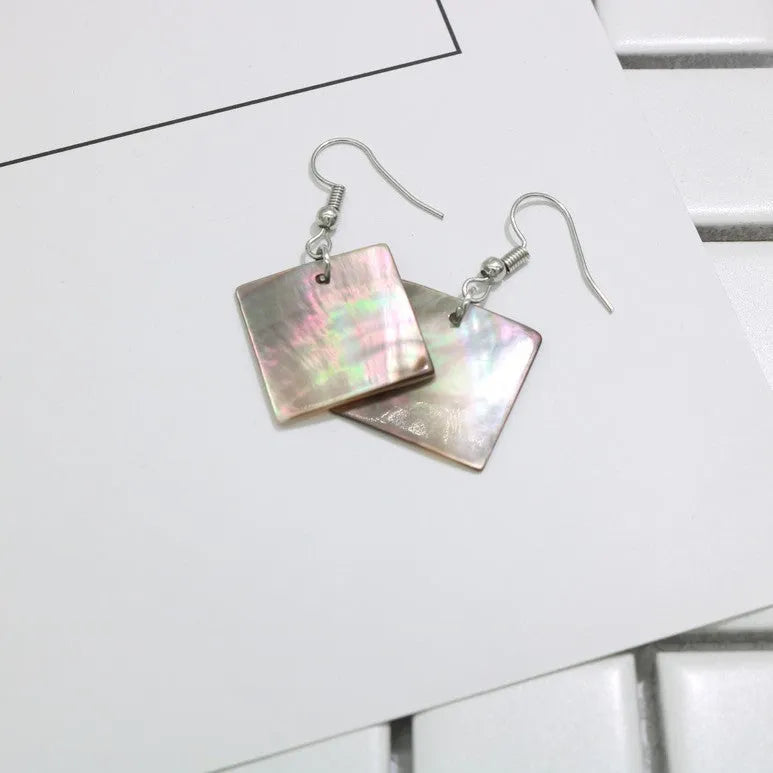 Geometric shell earrings in square panther or rectangular shell designs with natural finish