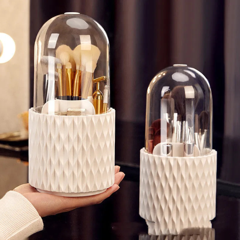 White rotating makeup brush storage holder with transparent lid on desktop