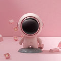 Spaceman Bluetooth speaker in moon astronaut design on desktop