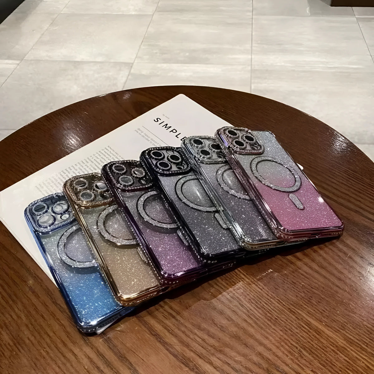 Rhinestone glitter magnetic phone case for Apple iPhone in black, pink, silver, blue, gold, and purple.