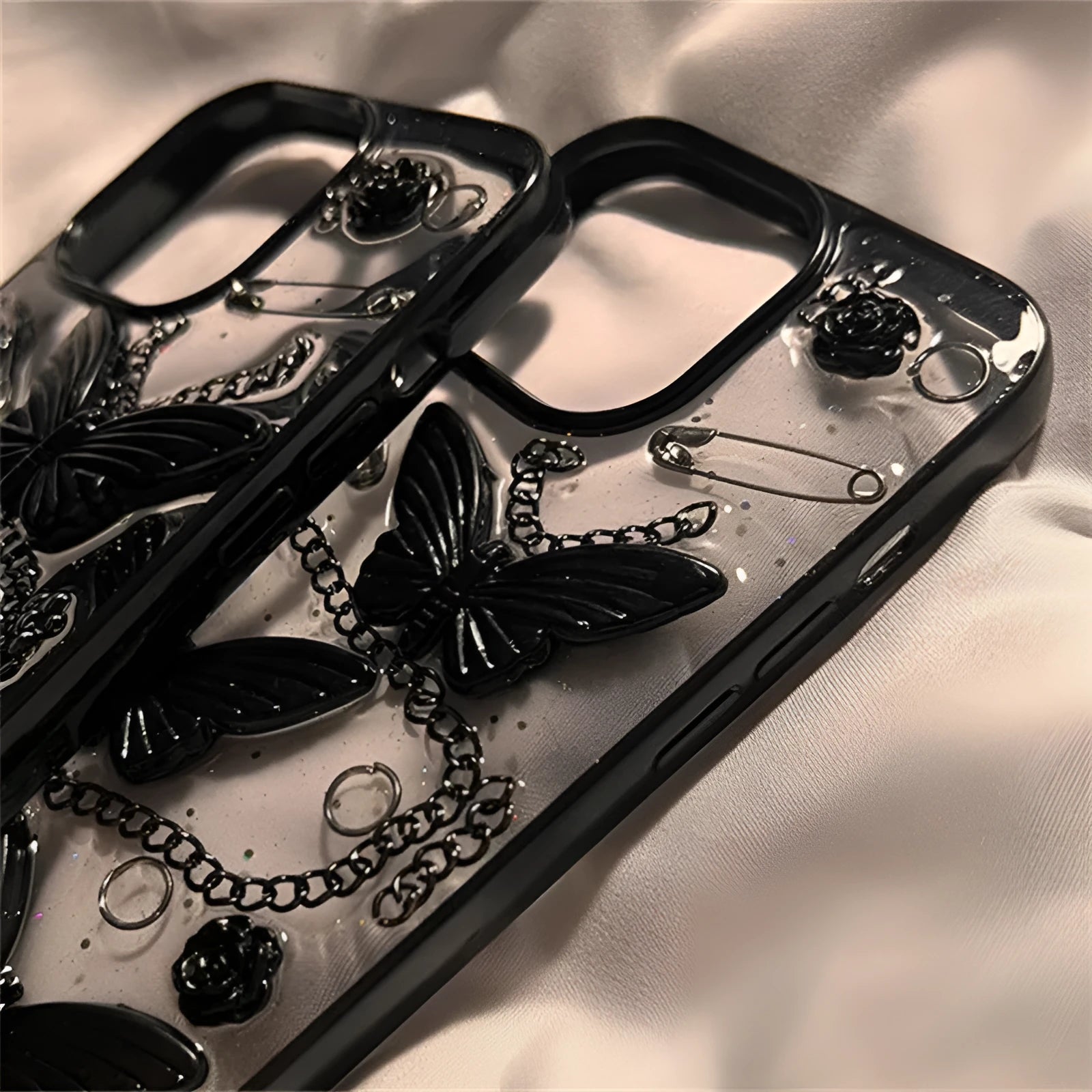 Black silicone phone case with three-dimensional butterfly design for Apple iPhone drop protection
