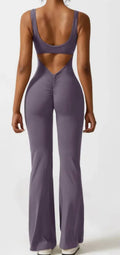 Women's black milk silk yoga bodysuit with seamless hollow design and mid waist.