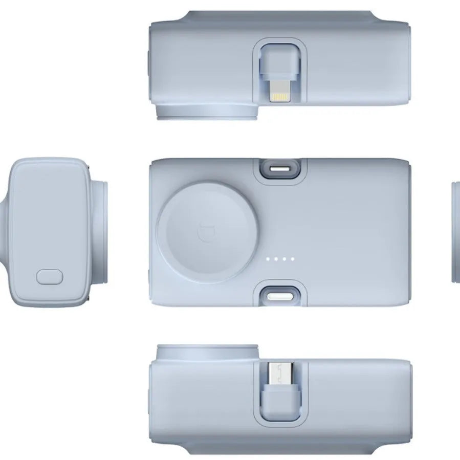 Compact white wireless power bank with 5000mAh capacity, shown next to a smartphone for scale.