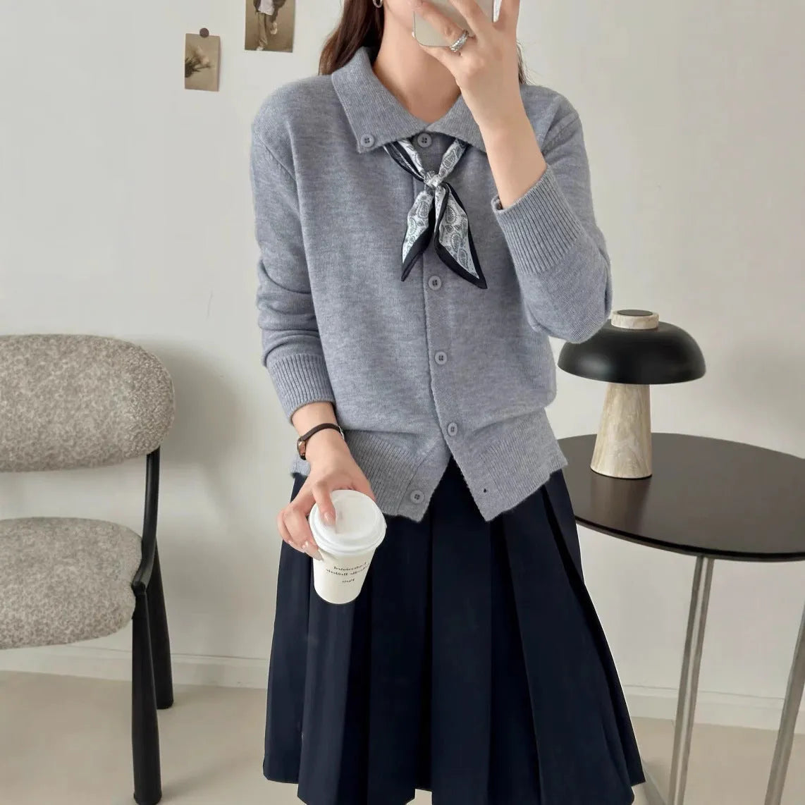 Lapel scarf sweater in cardigan style with long sleeves and splicing details