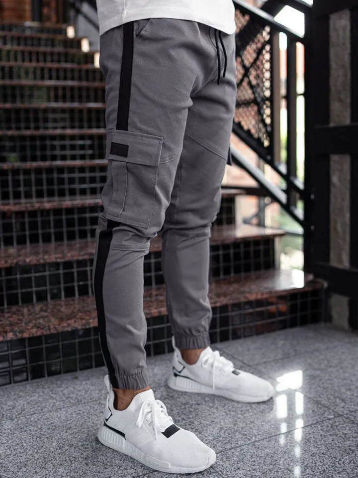 Men's leather bound casual pants in khaki, polyester fabric, mid waist, zipper placket, micro-elastic