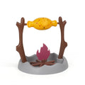 Barbecue style tumbling cat feeder toy for interactive food puzzle play.