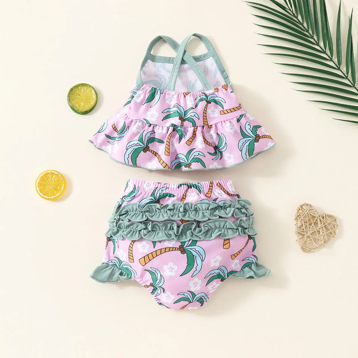 White polyester two-piece swimsuit set for girls, featuring a shirt and shorts.